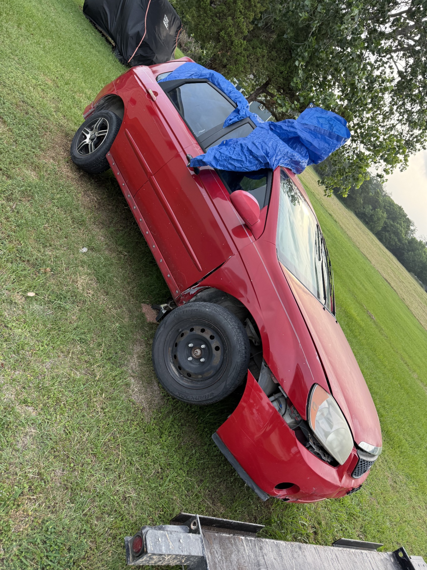 Red Sedan — Hauled Off